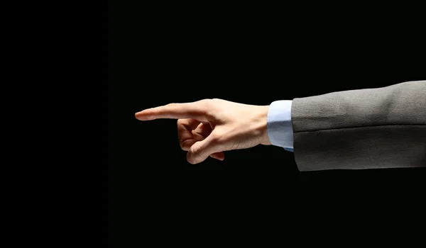 Poiniting zakenman hand, geïsoleerd op zwart — Stockfoto