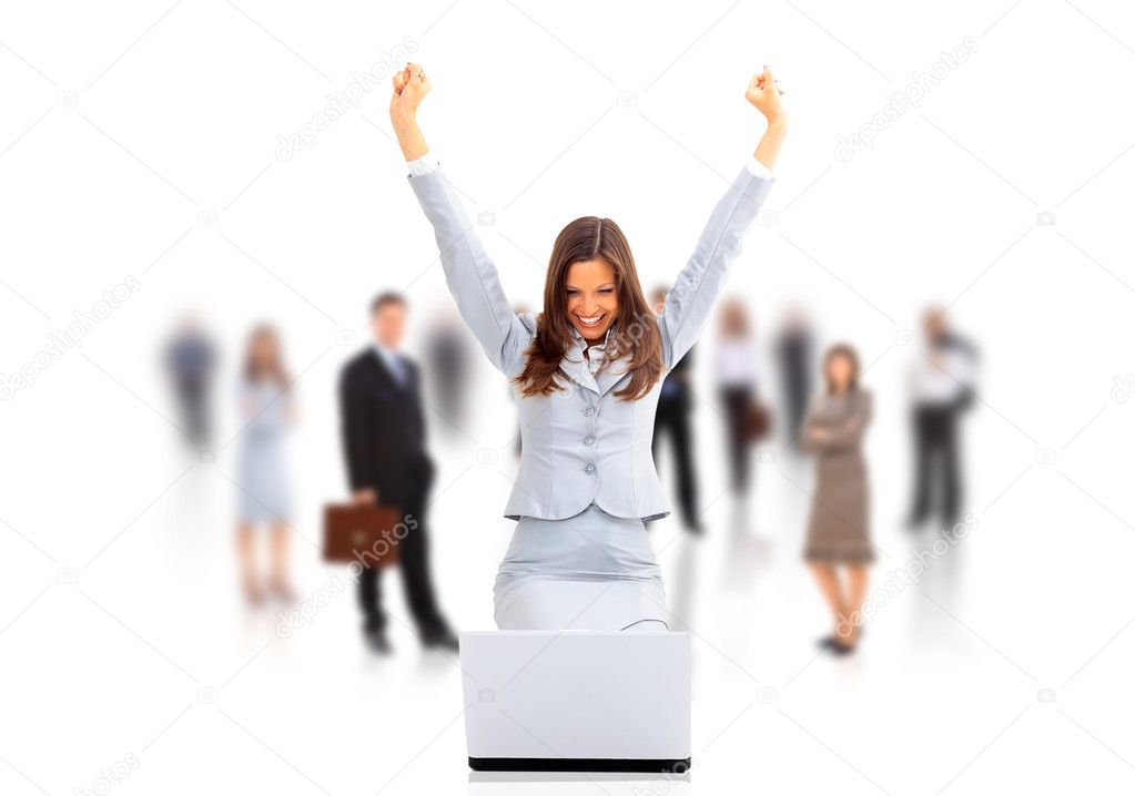 Business woman with her hands raised while working on laptop