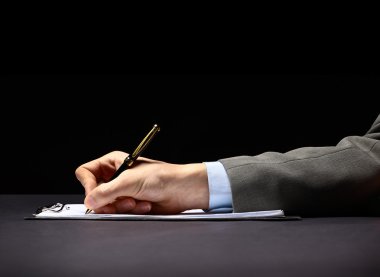 Businessman's hand with pen clipart