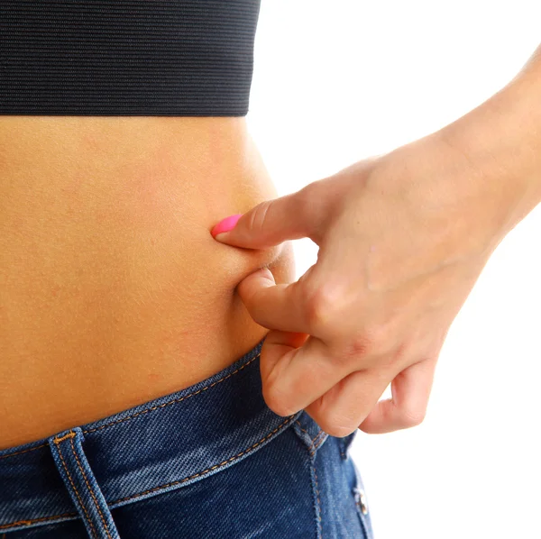 A woman measuring the thickness of her fat. — Stock Photo, Image