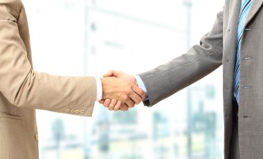 Business men hand shake in the office clipart