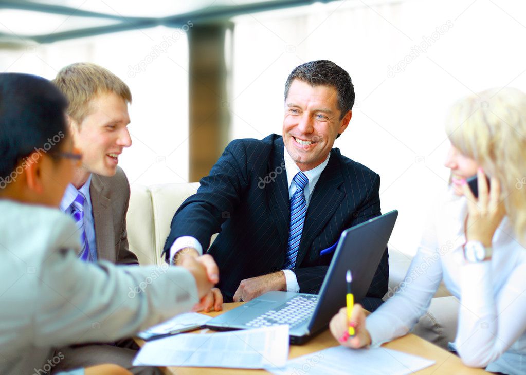 Business shaking hands, finishing up a meeting