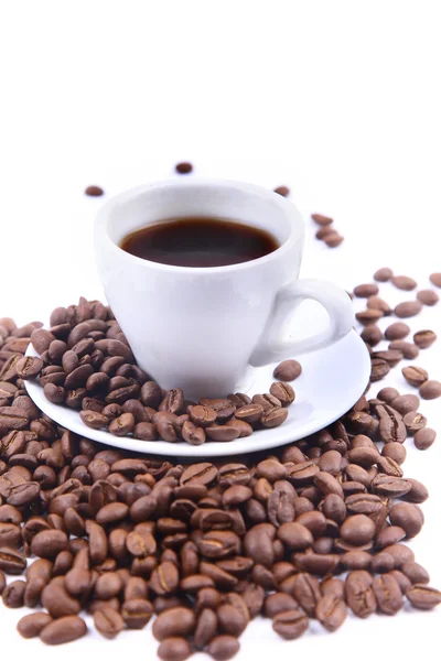 stock image Cup with coffee and beams. Focus on coffee beans