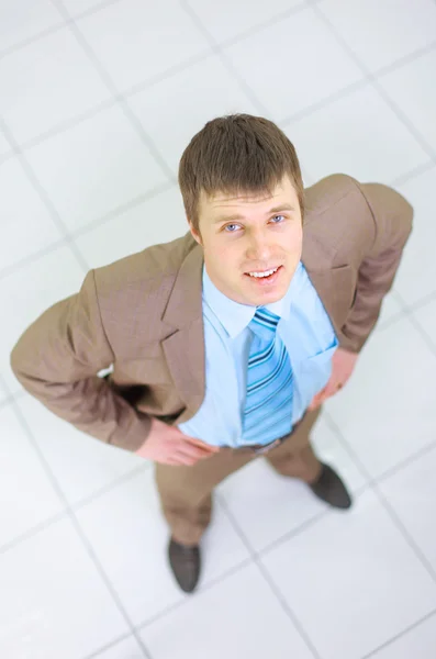 Happy businessman standing outside with arms outstretched — Stock Photo, Image
