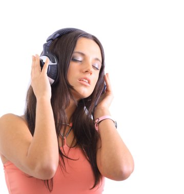 Radiant young woman listen to music wearing headphones isolated over white clipart