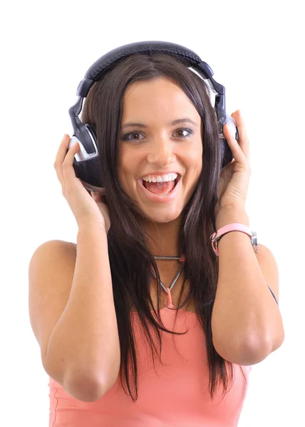 Portret van een mooi meisje luisteren naar muziek op haar grote hoofdtelefoon via — Stockfoto