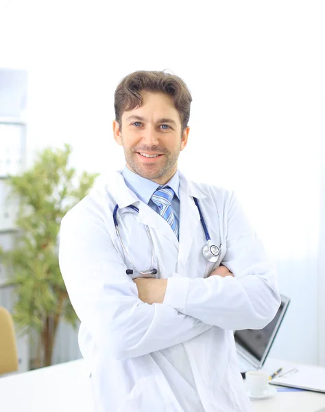 Portrait of a mature doctor with his hands folded — Stock Photo, Image
