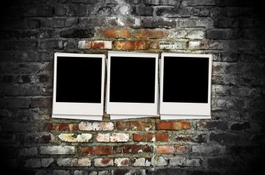 Three Blank Photos on Brick Background clipart