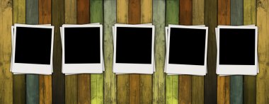 Blank Polaroids on Wooden Wall clipart