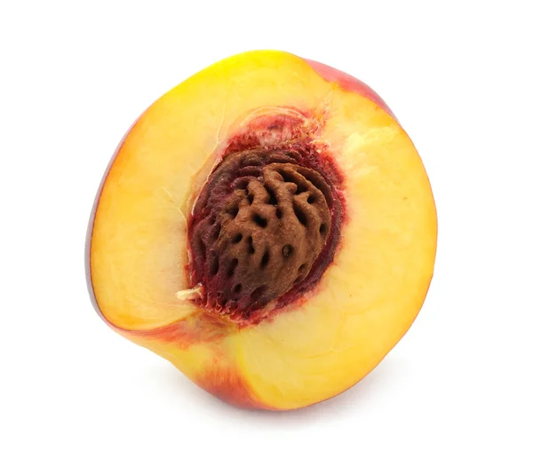 Половина персика — стоковое фото