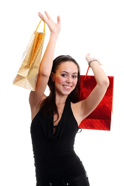 Retrato de uma jovem menina adulta feliz com sacos coloridos — Fotografia de Stock
