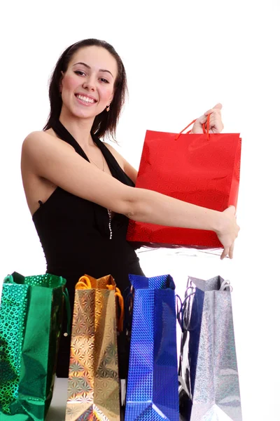 Portrait of one happy young adult girl with colored bags — Stock Photo, Image