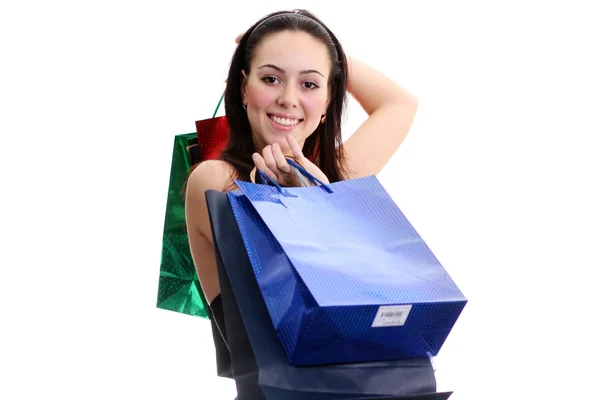 Portrait of one happy young adult girl with colored bags — Stock Photo, Image