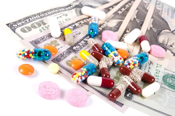 Pilules, capsules et dollars américains — Photo
