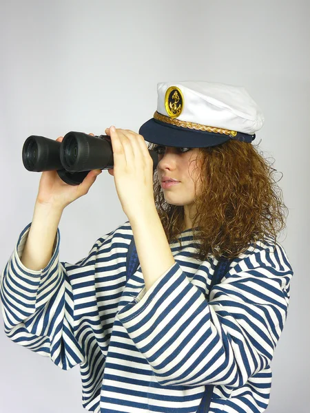 stock image Young girl in a captain's cap