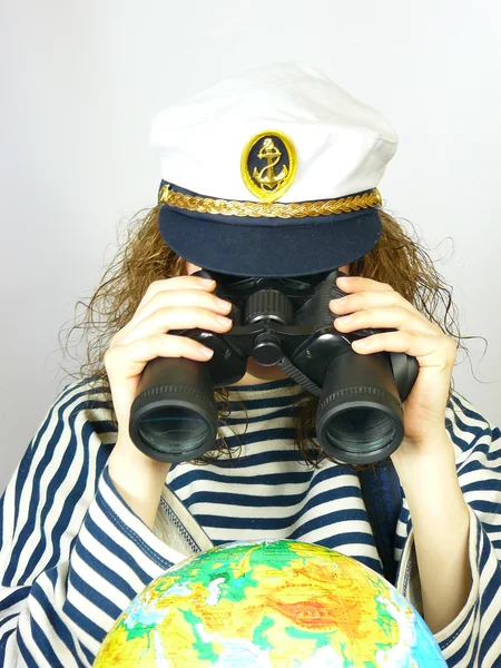 stock image Young girl looks at the globe