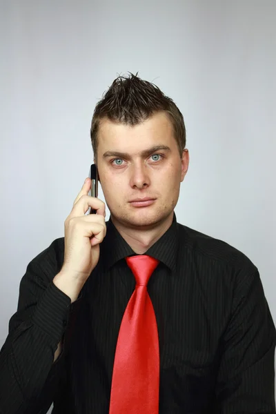 Man in a tie speaks on phone — Stock Photo, Image