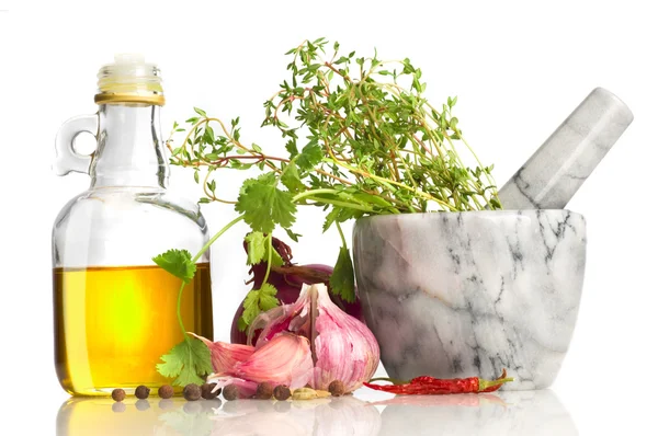Olive oil and mortar with spicery — Stock Photo, Image