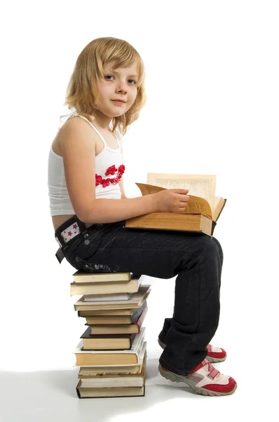 Menina com pilha de livro — Fotografia de Stock