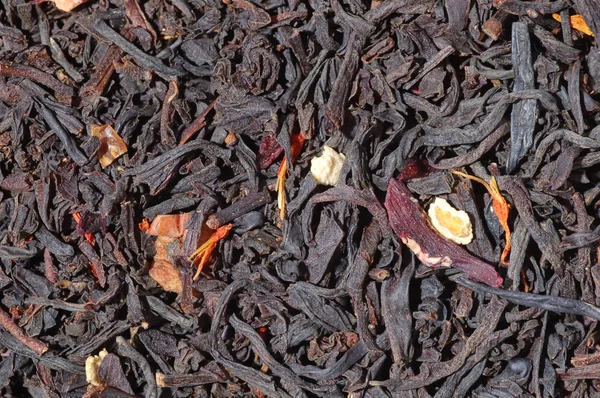 Liści herbaty czarne tło — Zdjęcie stockowe