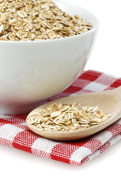 Oat flakes and spoon — Stock Photo, Image