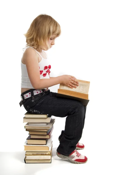Flicka med stack av bok — Stockfoto