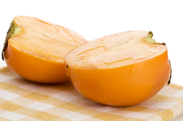 Persimmon on placemat isolated — Stock Photo, Image