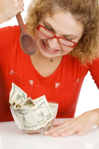 Girl eating money — Stock Photo, Image