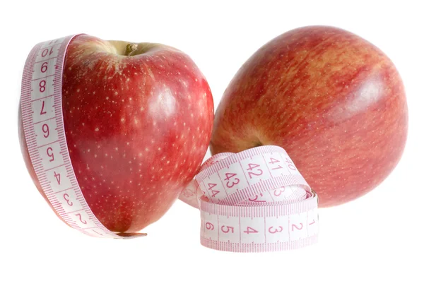 Jabłka i miarkę na białym tle — Zdjęcie stockowe