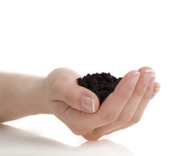Hand with soil on white — Stock Photo, Image