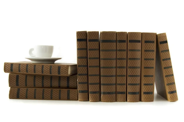 Stack of books and cup of coffee — Stock Photo, Image