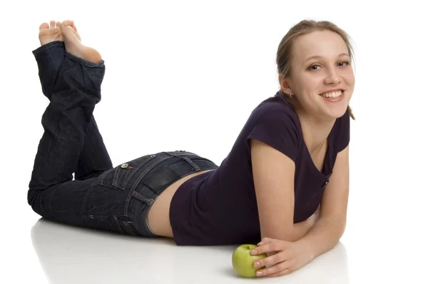 Happy girl with apple in hand — Stock Photo, Image