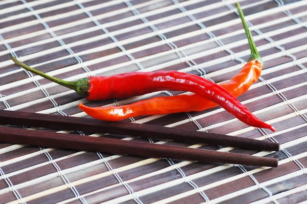 Chilli and chopsticks — Stock Photo, Image