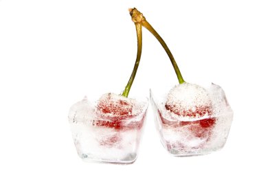 Close-up of two frozen cherries on white clipart