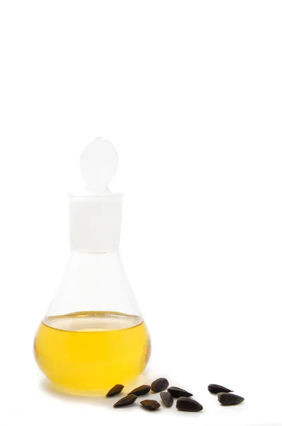 Sementes de girassol e óleo isolado — Fotografia de Stock