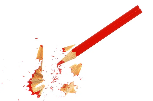 Een rood potlood en chips op wit — Stockfoto