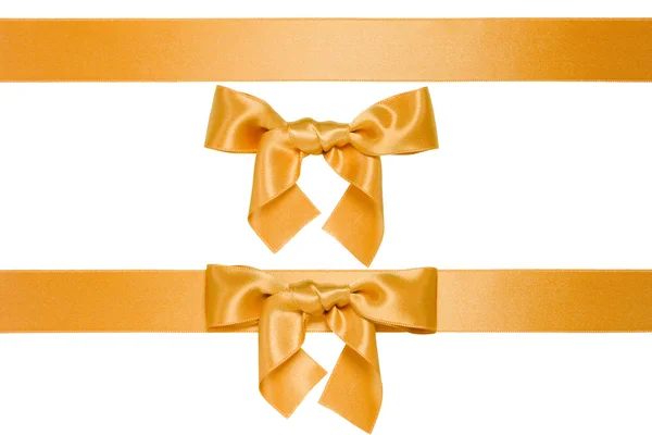 Golden multiple ribbons with bow — Stock Photo, Image