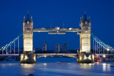 Tower Bridge illuminated at night time clipart