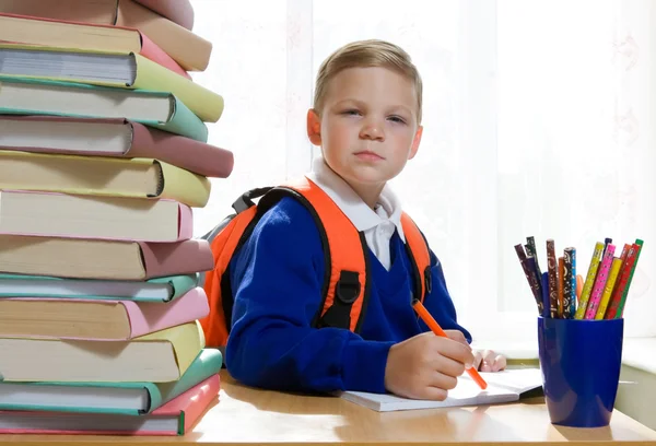 School boy sitting at the desk — Stock Photo, Image