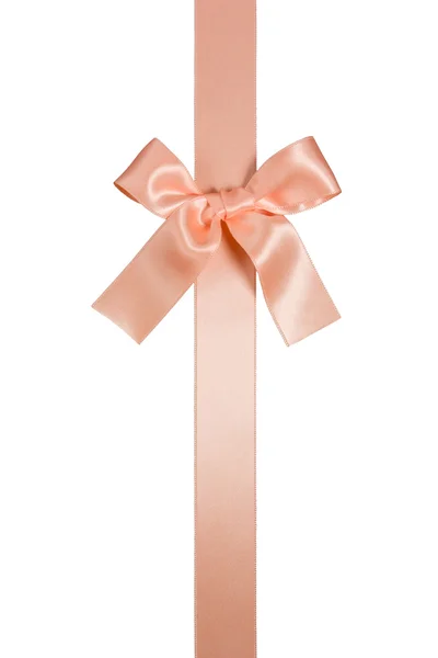 Вертикальна стрічка кремово-рожевого кольору з бантом ізольована — стокове фото