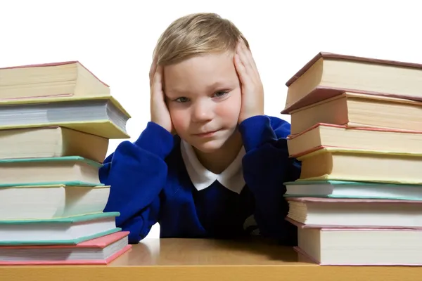 Schoolboy stinking at the desk — Stock Photo, Image