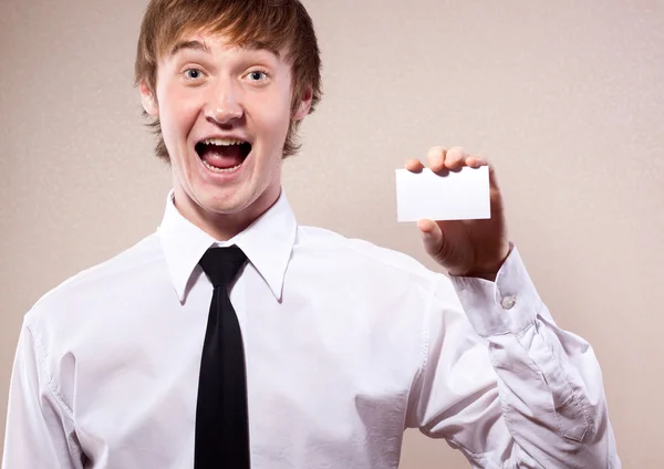 Businessman holding a blank business card — Stock Photo, Image