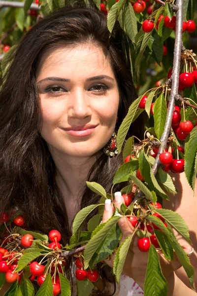 Girl with a sweet cherry — Stock Photo, Image