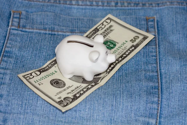 Piggy bank with american currency — Stock Photo, Image