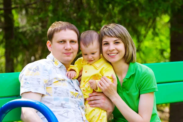 Family in the grass — Stock Photo, Image