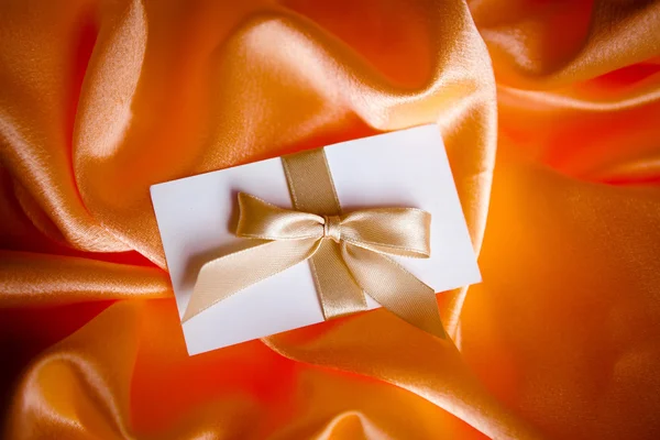 Letter with golden ribbon — Stock Photo, Image