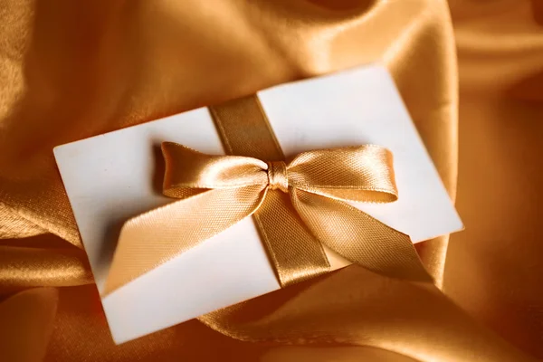 Letter with golden ribbon — Stock Photo, Image