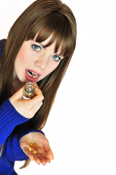 Girl taking pills — Stock Photo, Image