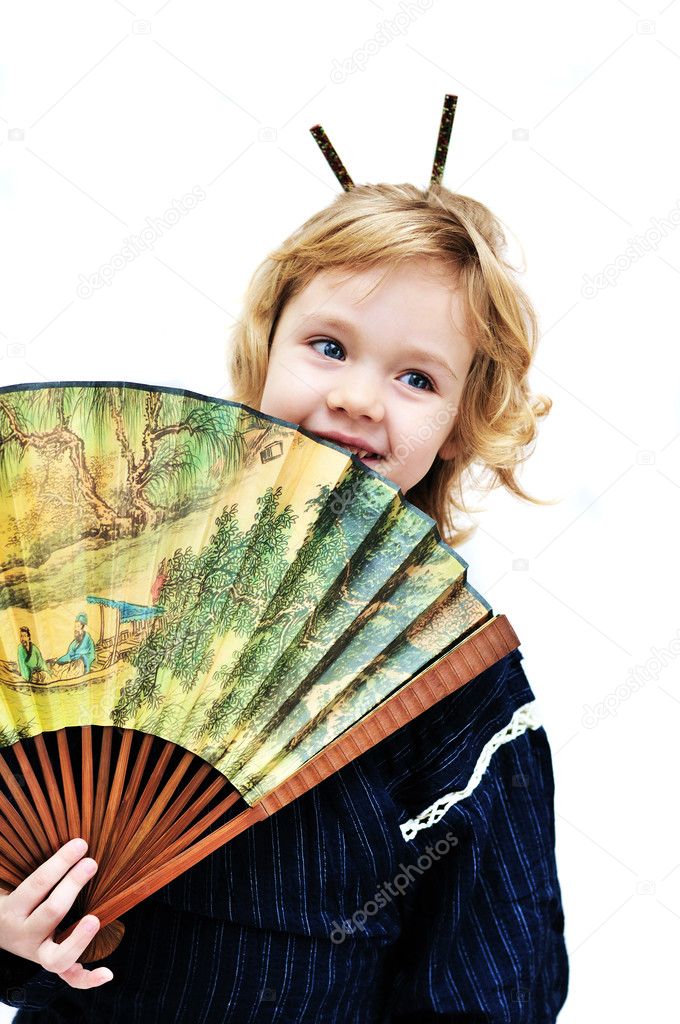 Little girl holding big fan