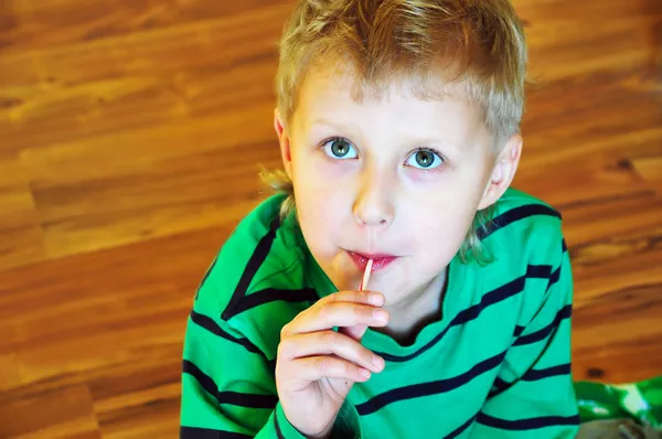 Cute little boy with lollipop — Stock Photo, Image